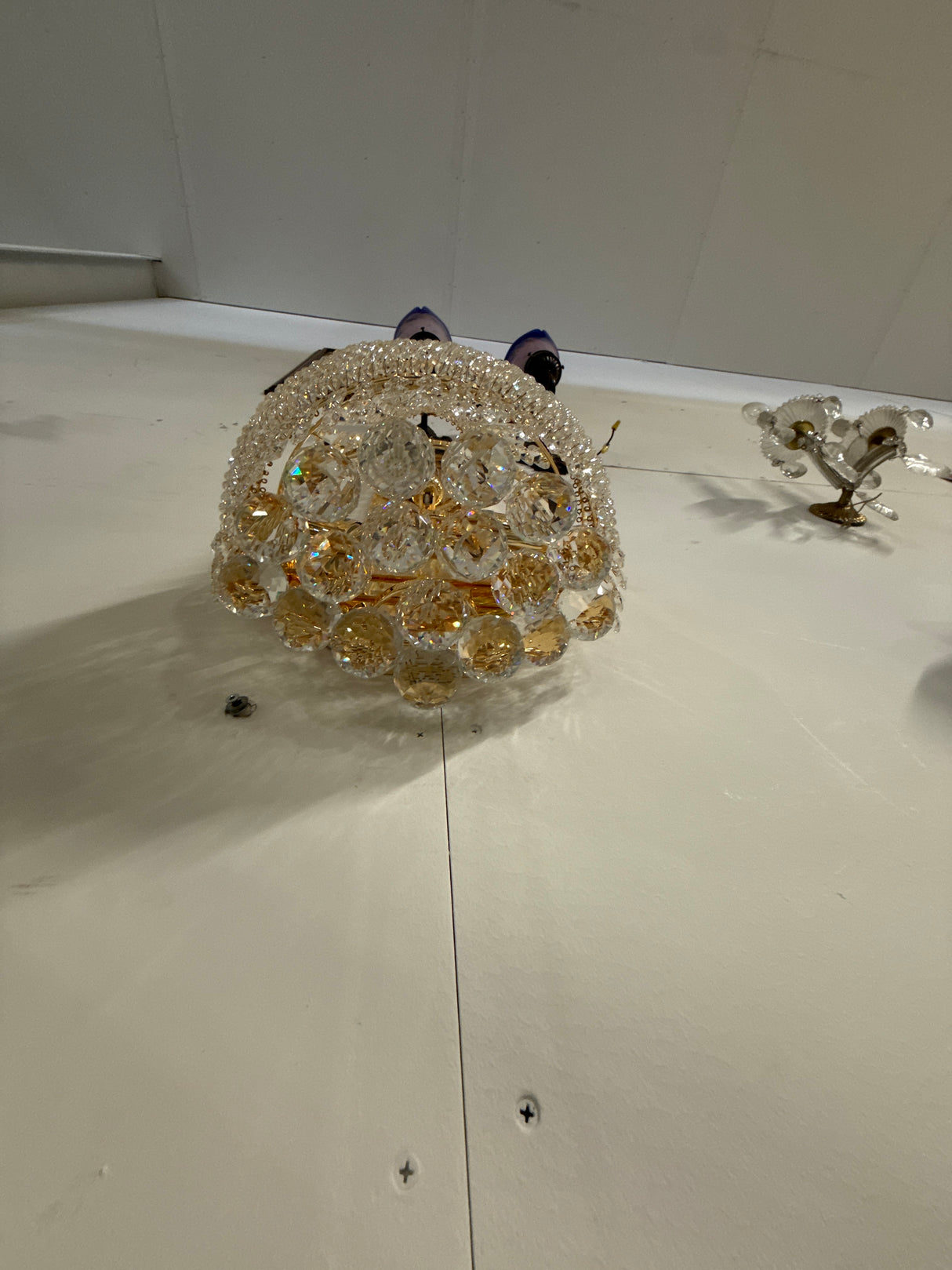 Beautiful gold-colored crystal wall lamp