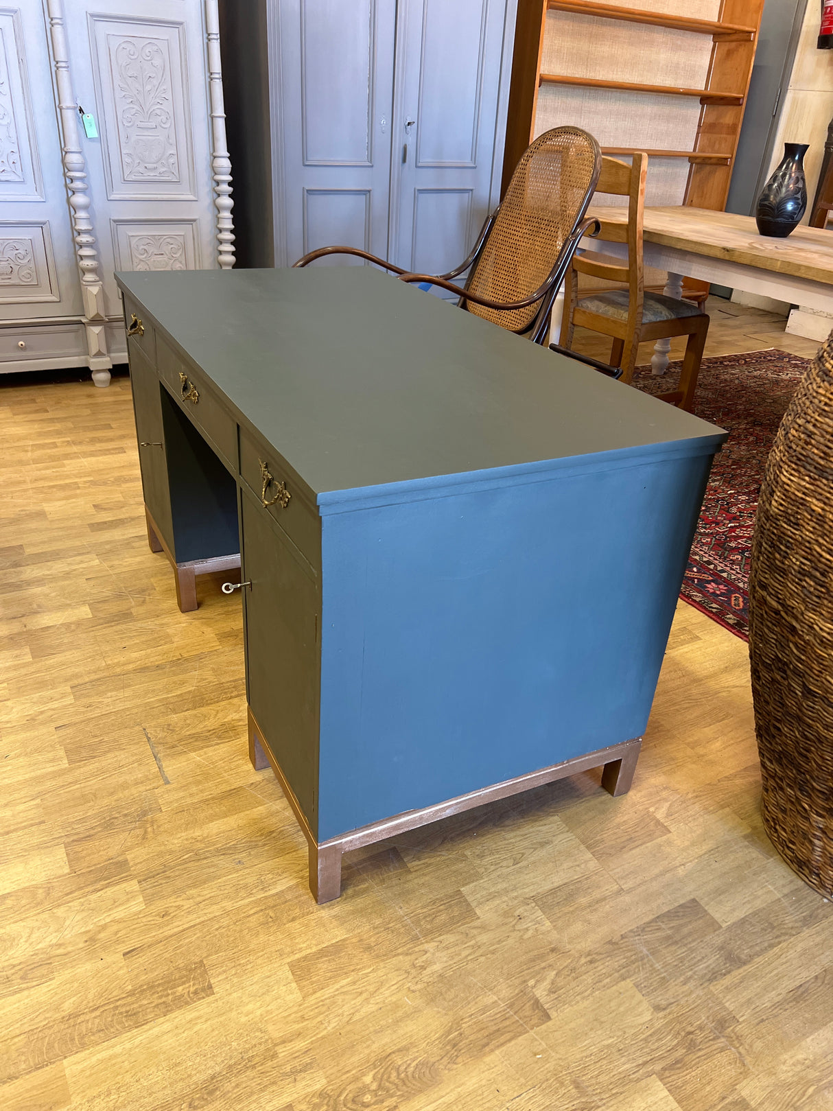 Desk W. 135cm, D. 68cm and H. 75cm.