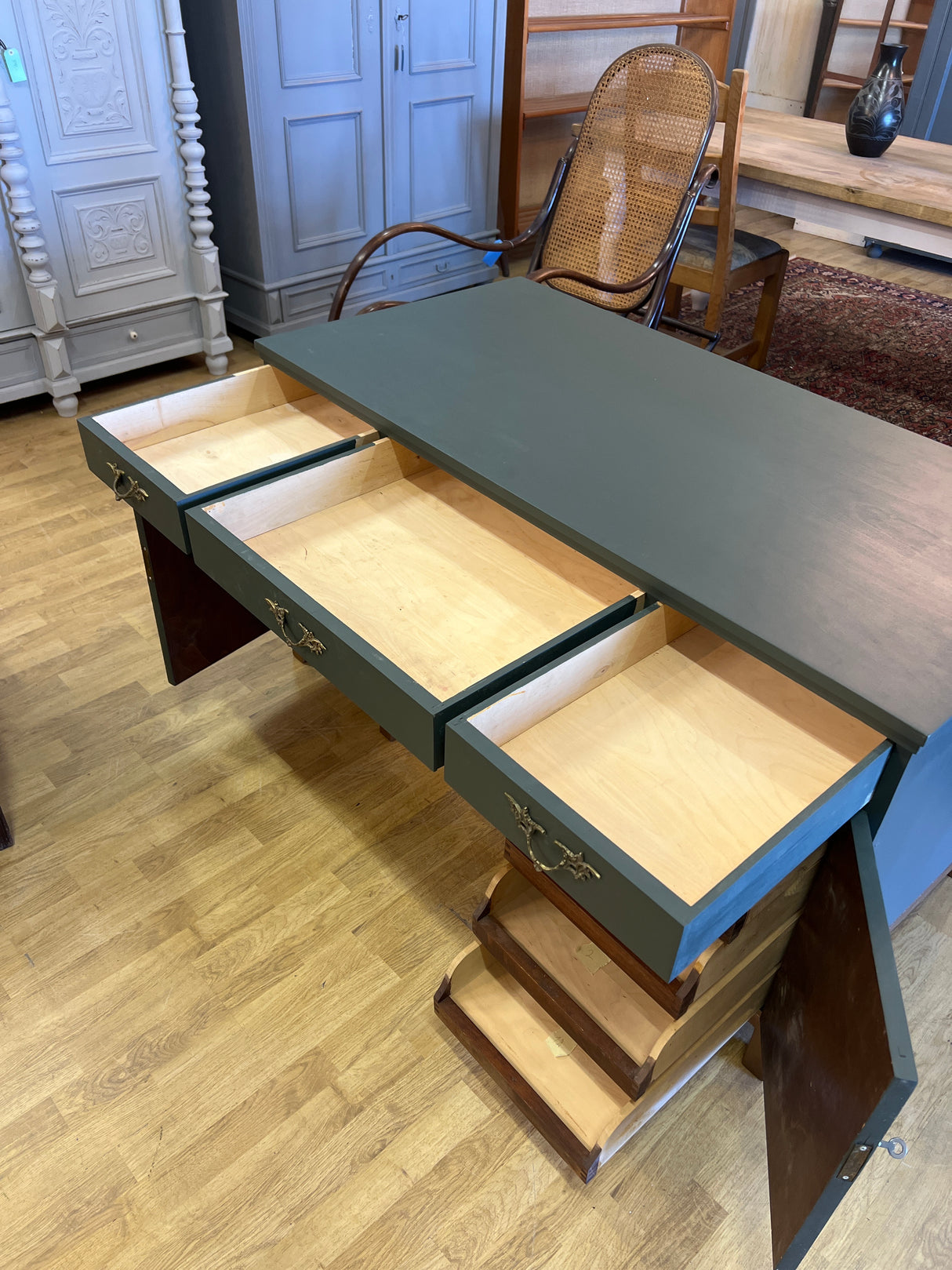 Desk W. 135cm, D. 68cm and H. 75cm.